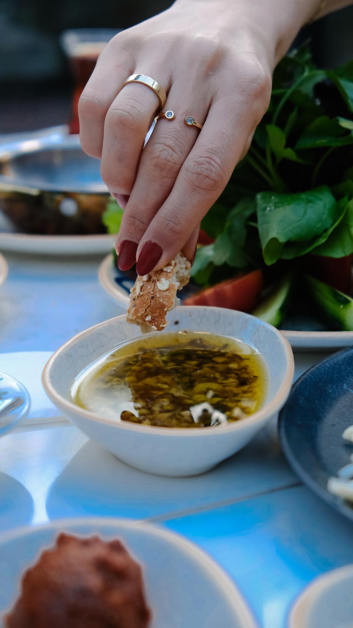 Close-up of herb and sauce detail on plate